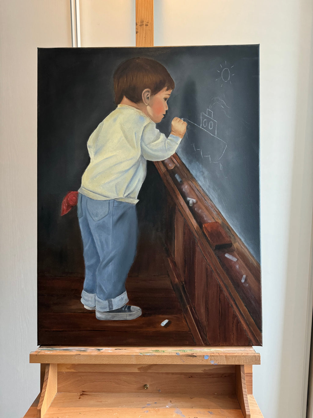 Boy draws on school board