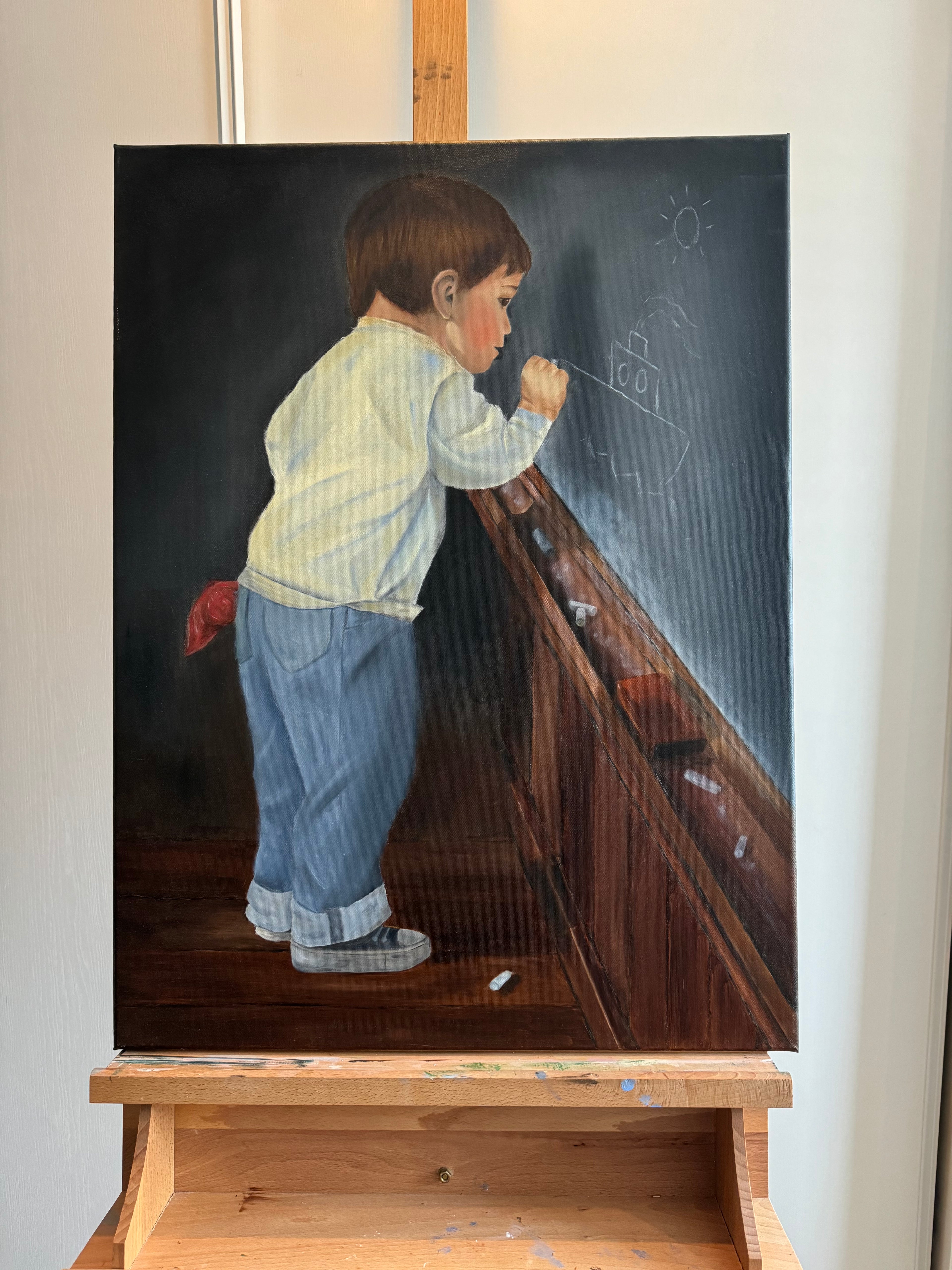 Boy draws on school board